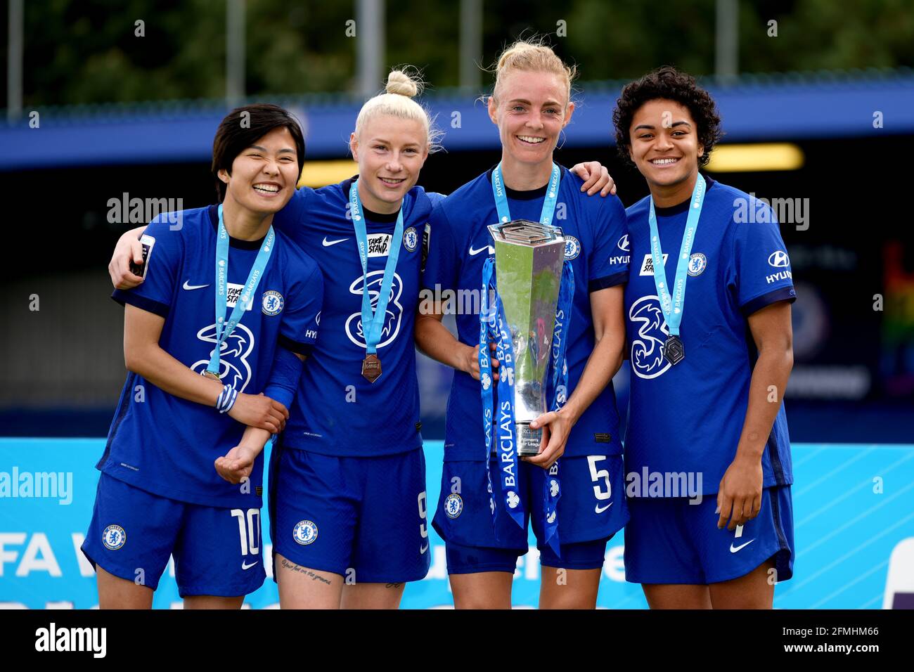 `l-r; `Chelsea's Ji So-yun, Bethany England, Sophie Ingle and Chelsea's Jess Carter hold the FA Women's Super League trophyduring the FA Women's Super League match at Kingsmeadow, London. Picture date: Sunday May 9, 2021. Stock Photo